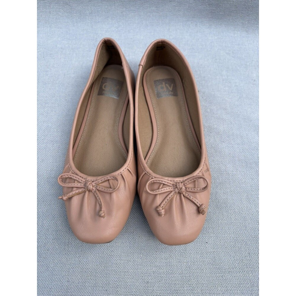 DV by Dolce Vita ballet flats featuring a small bow detail and a slip-on design.